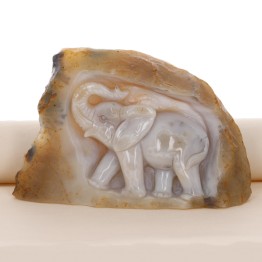 Carved elephant sculpture on rough agate