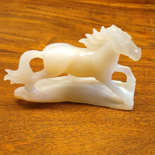 Sculpture horse carved on an agate base