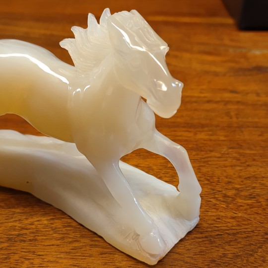 Sculpture horse carved on an agate base