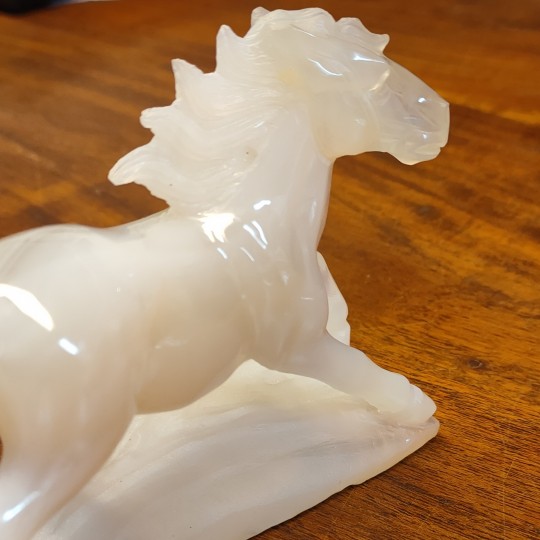 Sculpture horse carved on an agate base