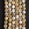 Strand of mottled beige mother pearl Ø 7.5 / 8 mm