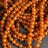 Strand of agate orange natural spherical cut Polished Ø 10 / 10.5 mm