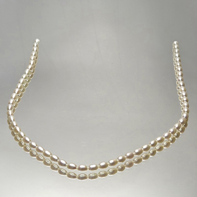 Strand of Pearl White ovals Ø 4 / 4.5 mm