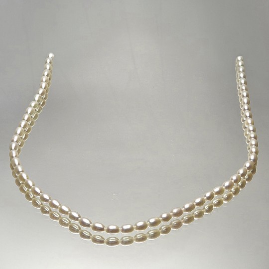 Strand of Pearl White ovals Ø 4 / 4.5 mm