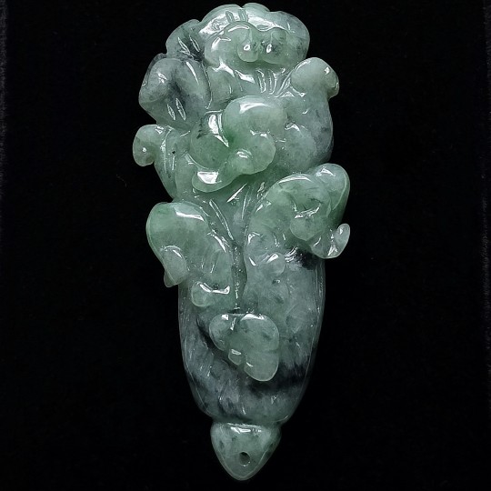 Gemstone of jade with floral engraving